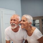 Cute mature couple brushing teeth